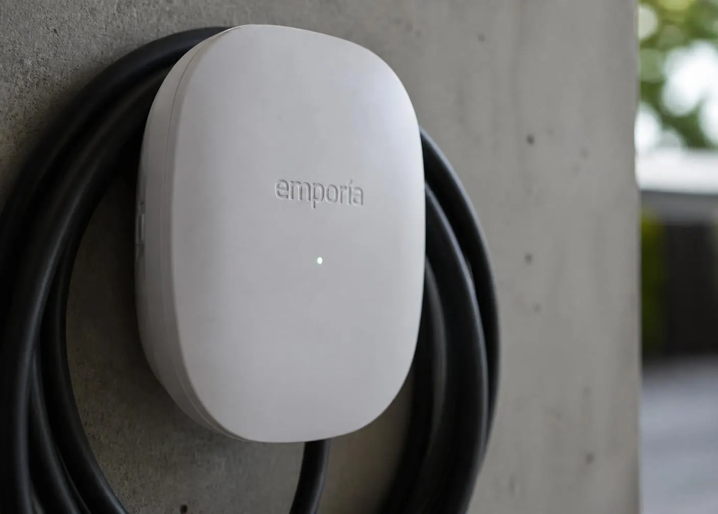 Close-up of a premium wall-mounted home EV charger